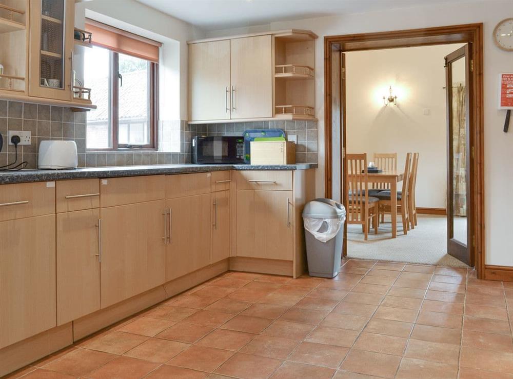 Well-equipped fitted kitchen at Dairy Cottage, 