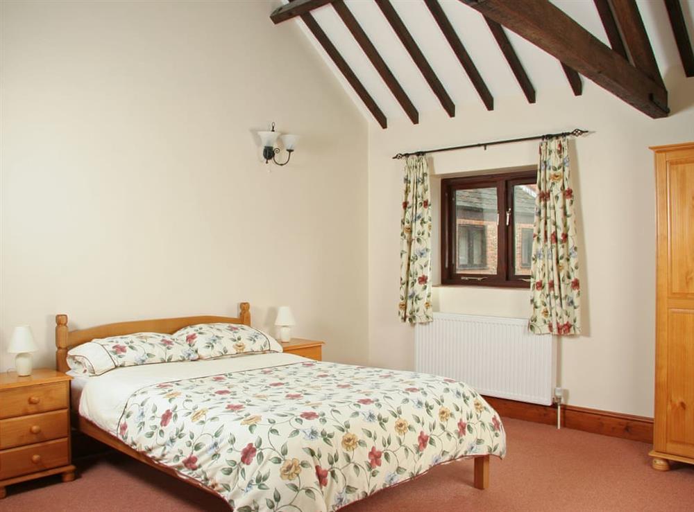 Characterful double bedroom at Littlewoods Barn, 