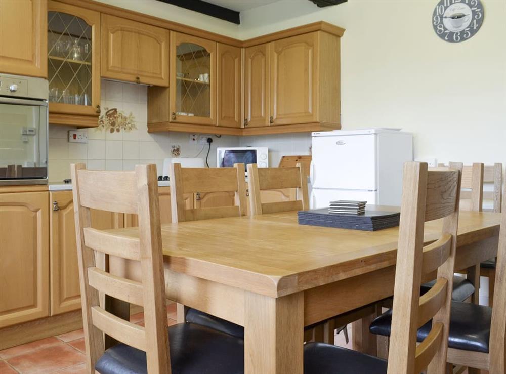 Convenient dining area within kitchen at Moor Farm Cottage, 