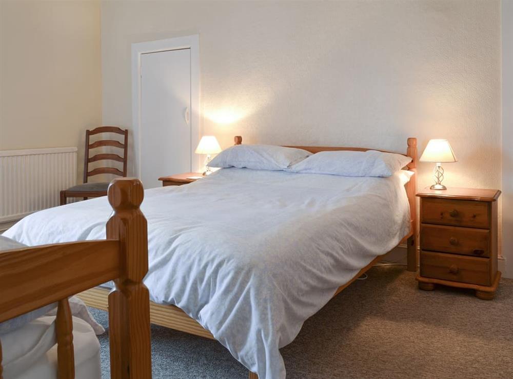 Family bedroom with a double and a single bed at Moor Farm Cottage, 