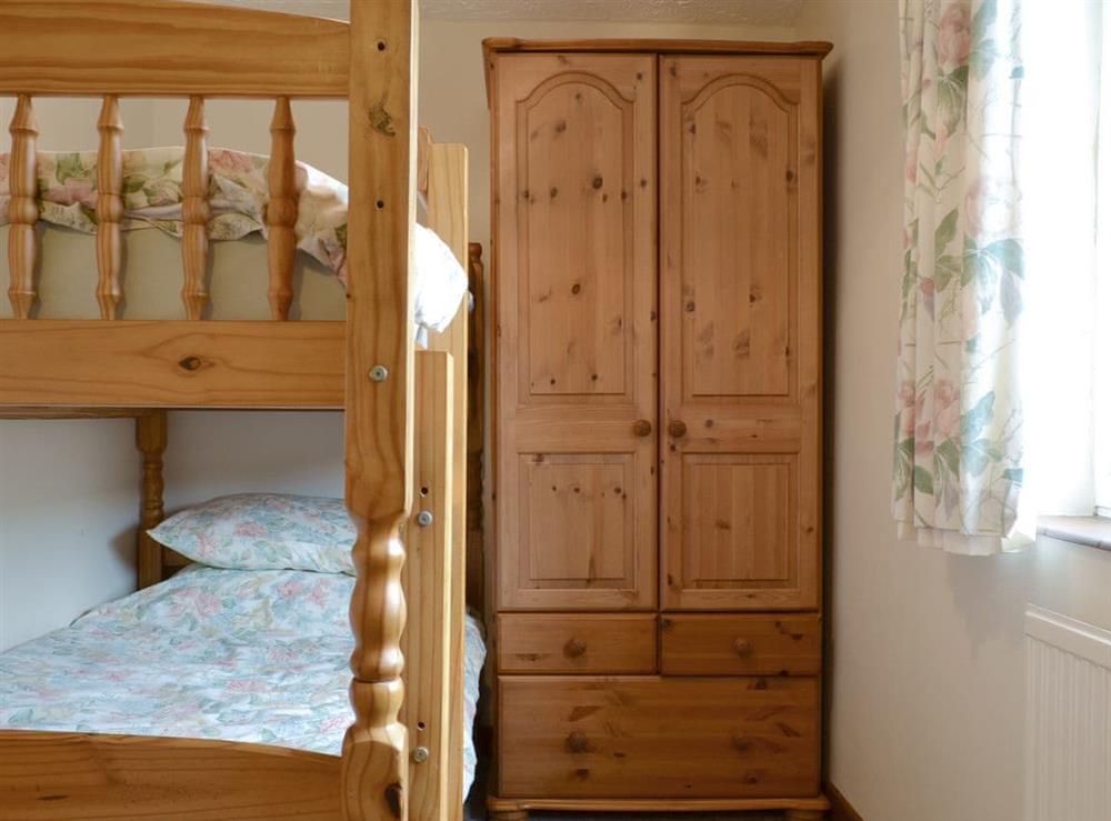 Comfortable bunk bedroom at Stable Cottage 7, 