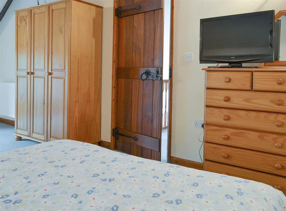 Ample storage within the master bedroom at The Old Workshop, 