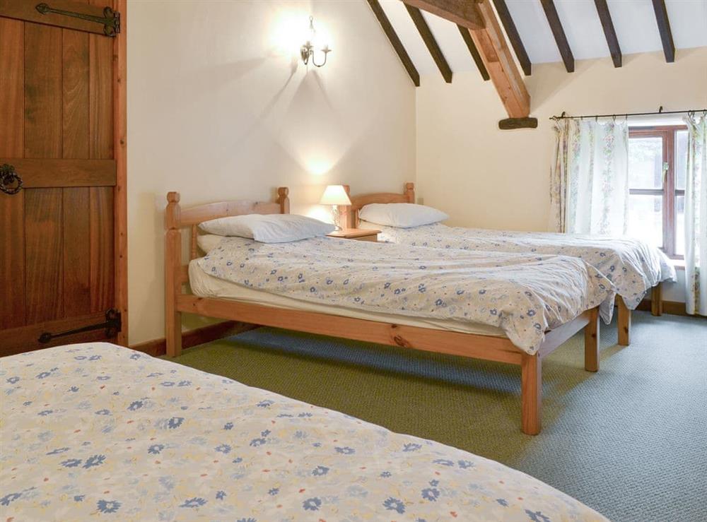 Spacious family bedroom the twin beds and a double at The Old Workshop, 