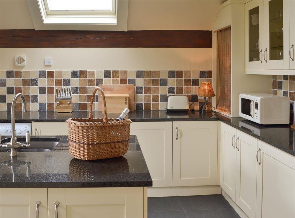 Charming tiled kitchen at Moorgarth Hall in Ingleton, Yorkshire, North Yorkshire