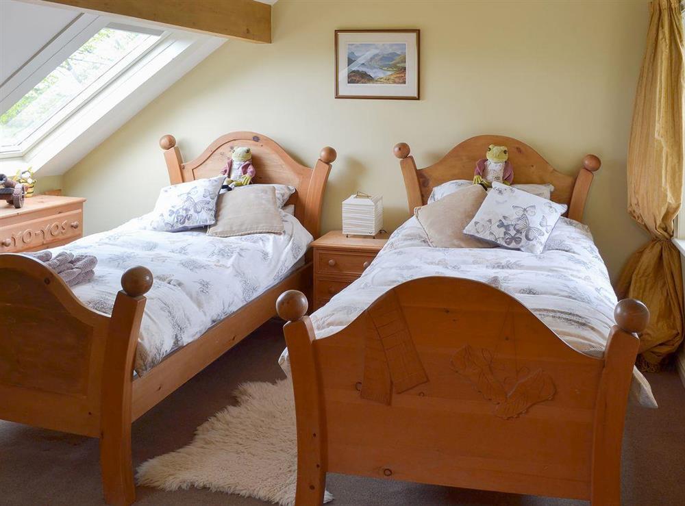 Twin bedded room with sloping ceiling and roof light at Moorgarth Hall in Ingleton, Yorkshire, North Yorkshire