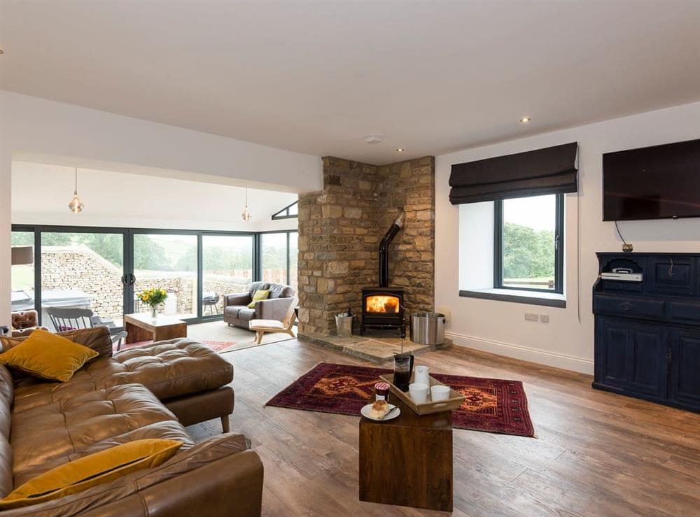 Comfortable living area with wood burner at Moorgate Barn in Kelbrook, near Barnoldswick, Lancashire