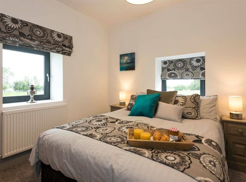 Relaxing bedroom with kingsize bed and en-suite at Moorgate Barn in Kelbrook, near Barnoldswick, Lancashire