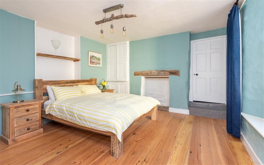 Another view of the master ground floor bedroom, with doorway to the bunk room and bathroom at Moorings in Cawsand