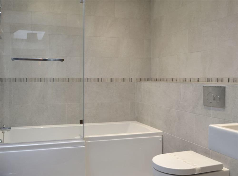 Family bathroom with shower over bath at Moorland Cottage in Hutton-le-Hole, near Kirkbymoorside, North Yorkshire