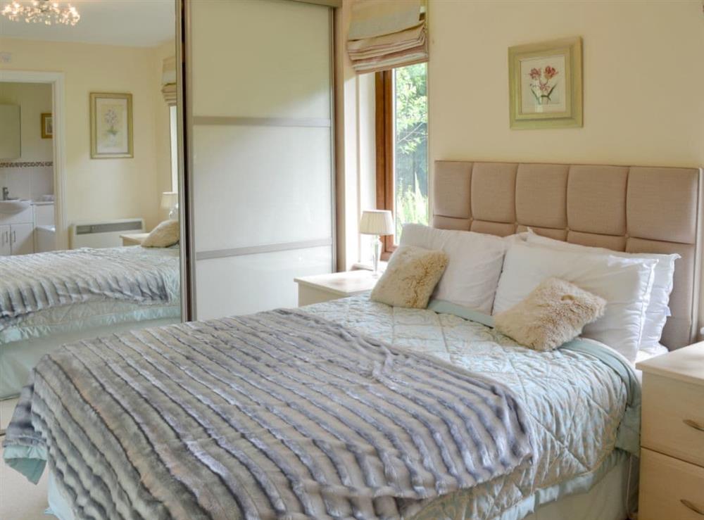 Comfortable double bedroom at Moorland Lodge in Holt Wood, near Wimborne, Dorset