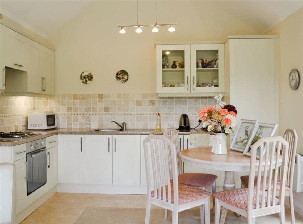 Well equipped, charming, kitchen dining area at Moorland Lodge in Holt Wood, near Wimborne, Dorset