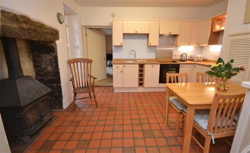 The dining kitchen with wood stove. at Moorlands Cottage in Belstone