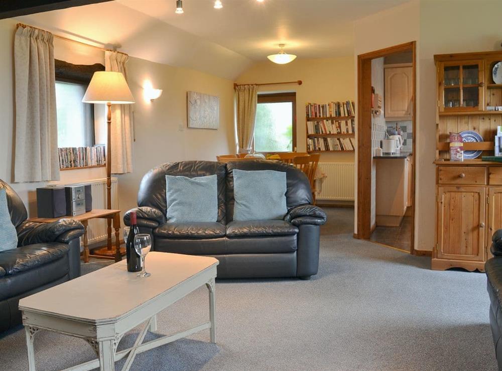 Well presented living/ dining room at Moorview Cottage in Cuddlipptown, near Tavistock, Devon