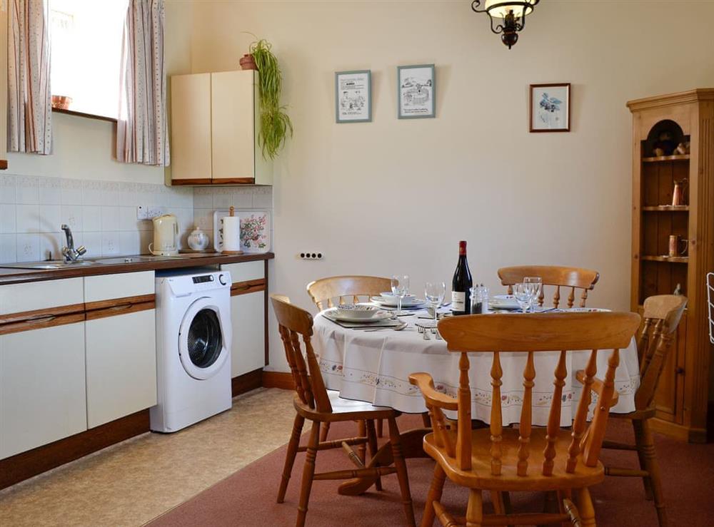 Kitchen with dining area at Owls Retreat, 