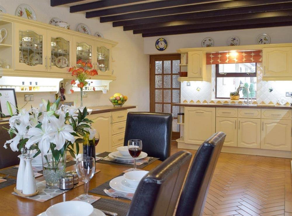 Fully equipped kitchen with dining area at Morfa in Amroth, near Saundersfoot, Dyfed