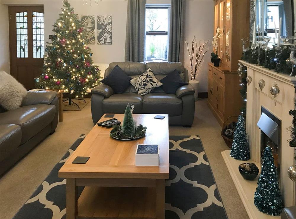 Living room with seasonal decor at Morfa in Amroth, near Saundersfoot, Dyfed