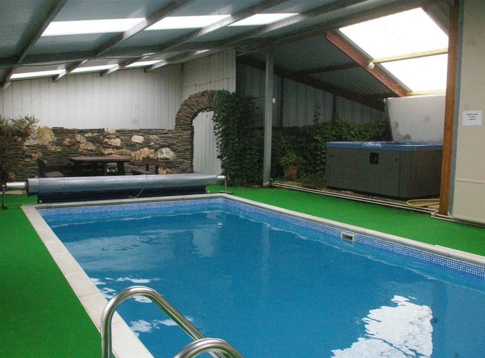 Shared swimming pool and hot tub at The Carthouse, 