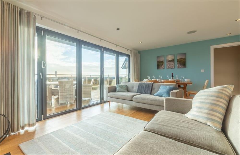 Morvah, St Agnes. Stunning open plan sitting room with bi-folding doors out to the deck at Morvah, Chapel Porth, St Agnes