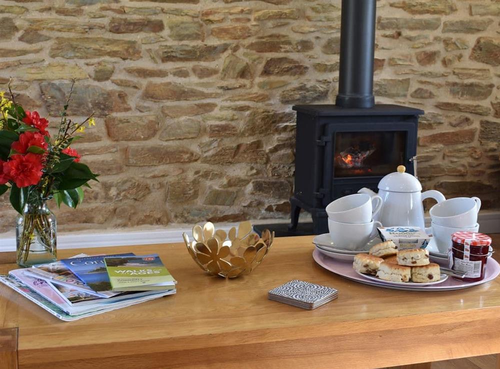Relax in front of the warming log burner at Bull Pen, 