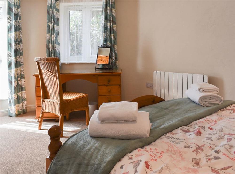 Comfortable bedroom with complementary furniture at Trotters, 