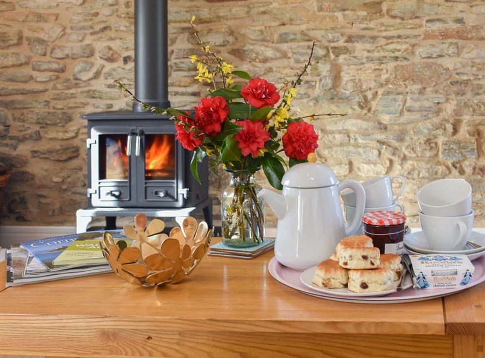 Warm and cosy living area with wood burner at Trotters, 