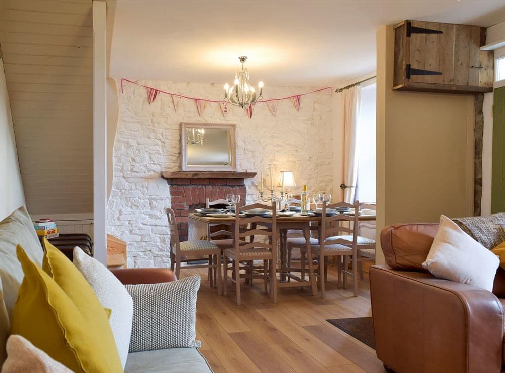 Attractive and warm living and dining room at Moss Cottage in Burry Port, near Llanelli, Carmarthenshire, Dyfed