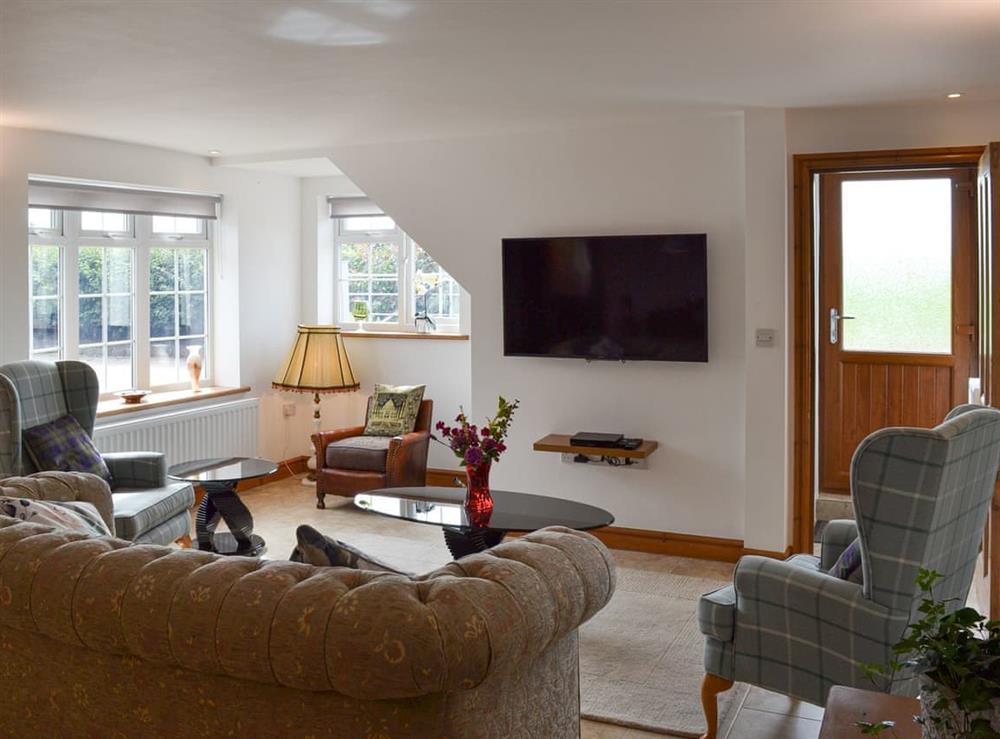 Living room at Moss Hall Barn in Rushton, near Tarporley, Cheshire