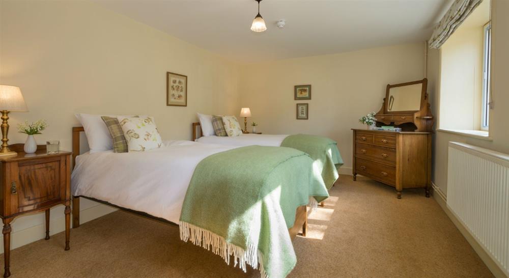 A twin bedroom at Mottistone Manor Farmhouse in Newport, Isle Of Wight