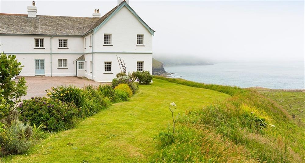 The exterior of Doyden House, which contains the Rumps, Carnweather, Mouls and Conor apartments, Port Isaac, Cornwall at Mouls in Port Quin, Cornwall