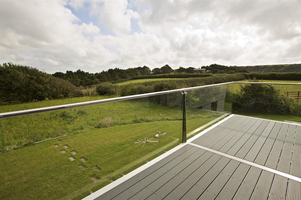 Balcony with views over the garden and across neighbouring countryside at Moult Hill Barn in , Salcombe