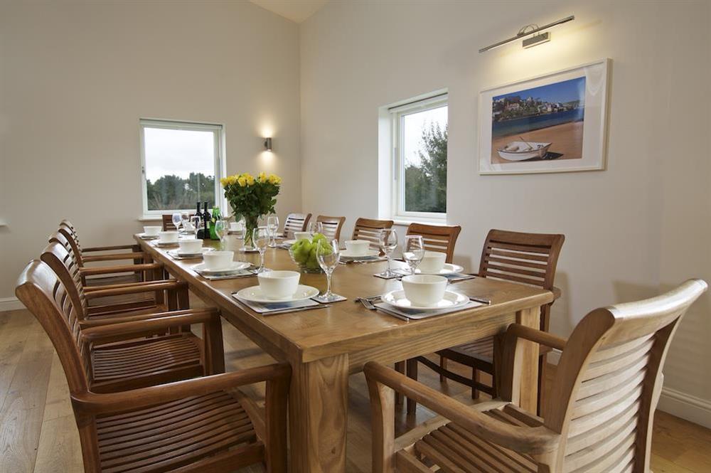 Long wooden dining table seating twelve guests comfortably (photo 2) at Moult Hill Barn in , Salcombe