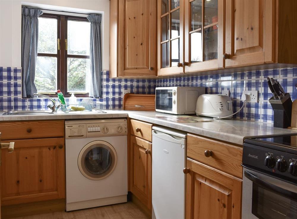 Well-equipped fitted kitchen at Prince Croft Cottage, 