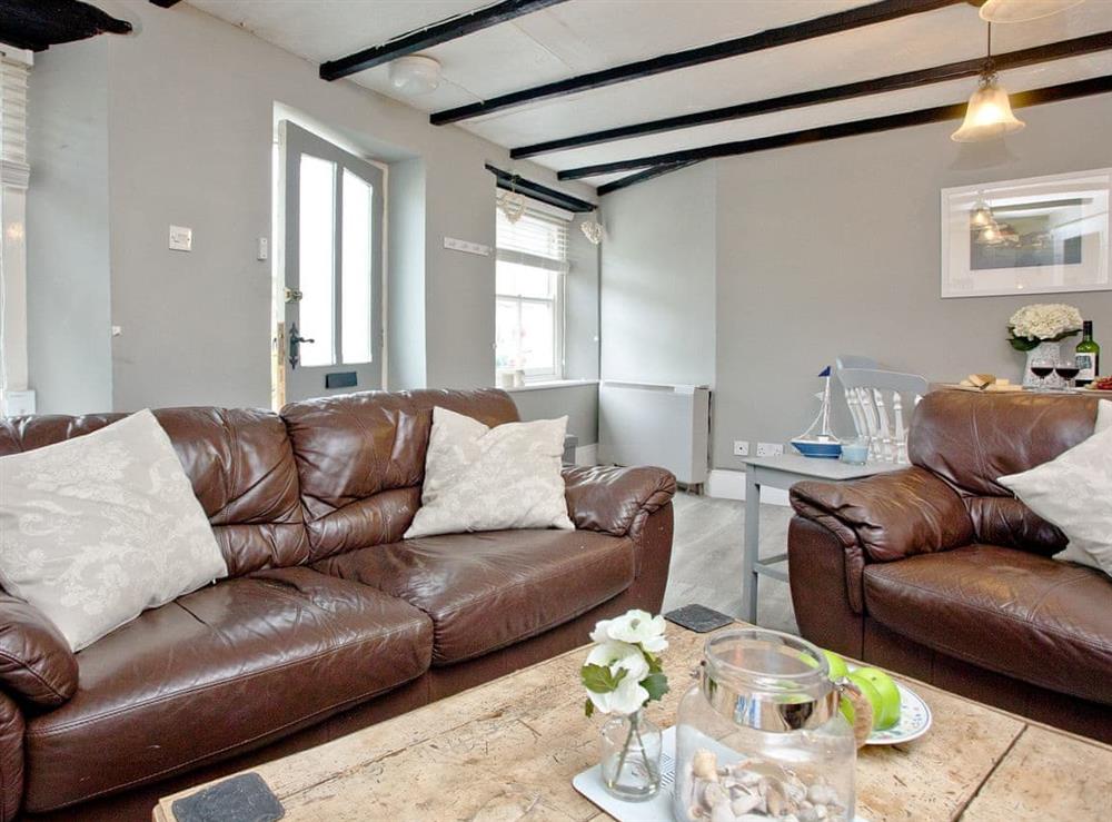 Comfortable living room with beamed ceiling at Mount Street Cottage in Mevagissey near St. Austell, Cornwall, England