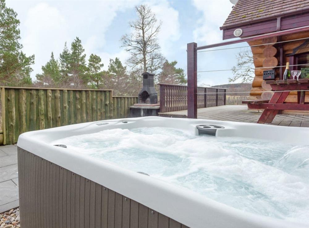 Relaxing private hot tub at Mountain Bear Lodge in Nethy Bridge, near Aviemore, Highlands, Inverness-Shire