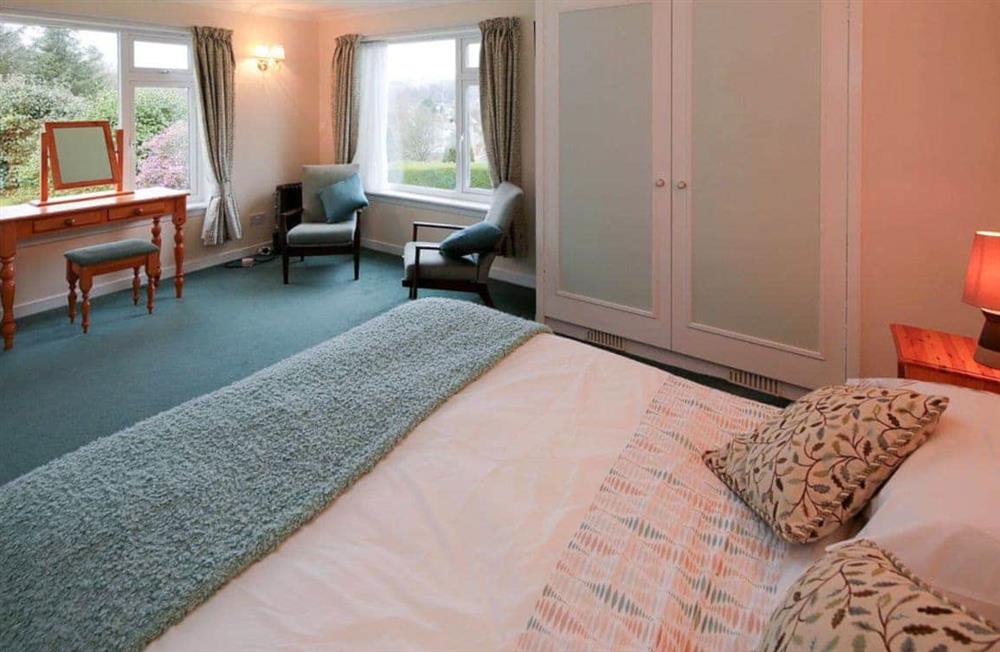 Ground floor double bedroom with infants’ cot at Mountain Cross in Gatehouse of Fleet, Kirkcudbright., Kirkcudbrightshire