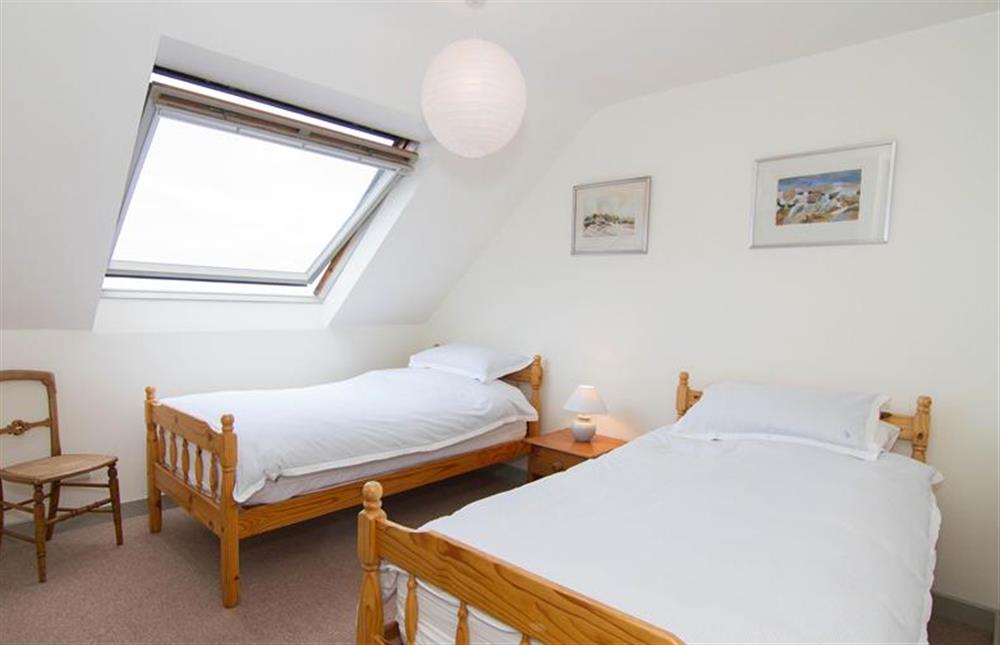 First floor: Bedroom two has full size twin single beds and great views at Mow Creek Cottage, Brancaster Staithe near Kings Lynn