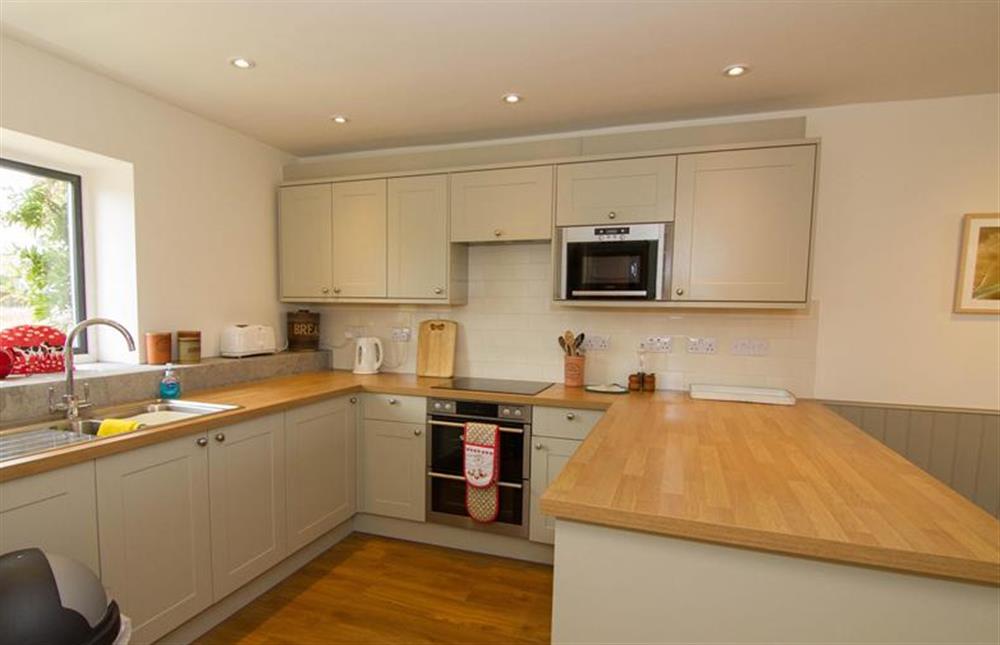 Ground floor: Well-equipped fitted kitchen at Mow Creek Cottage, Brancaster Staithe near Kings Lynn