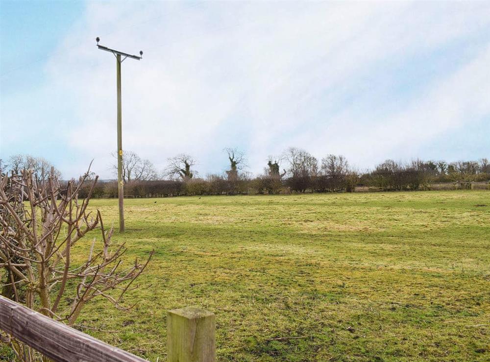 Open farmland surrounds the property at 1 Bedroom, 