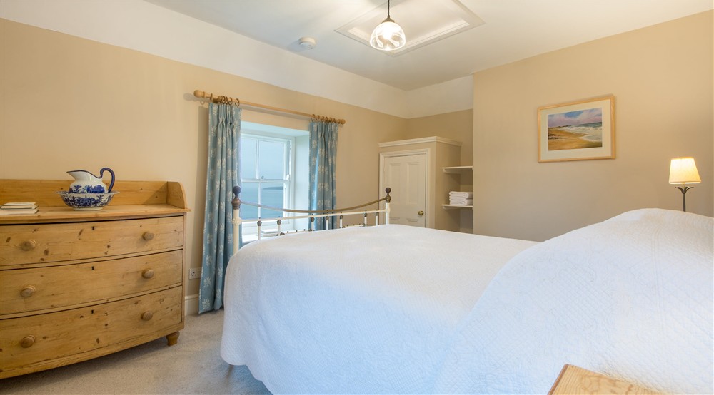 The double bedroom has sea views at Mowhay in Truro, Cornwall
