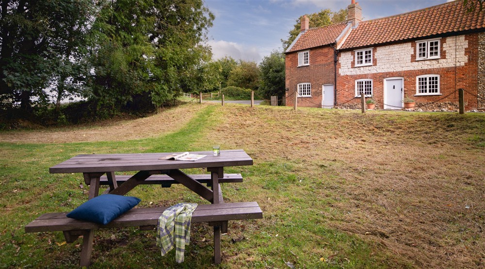 The shared area overlooking the mill stream opposite Mrs Preedys Cottage, Norfolk