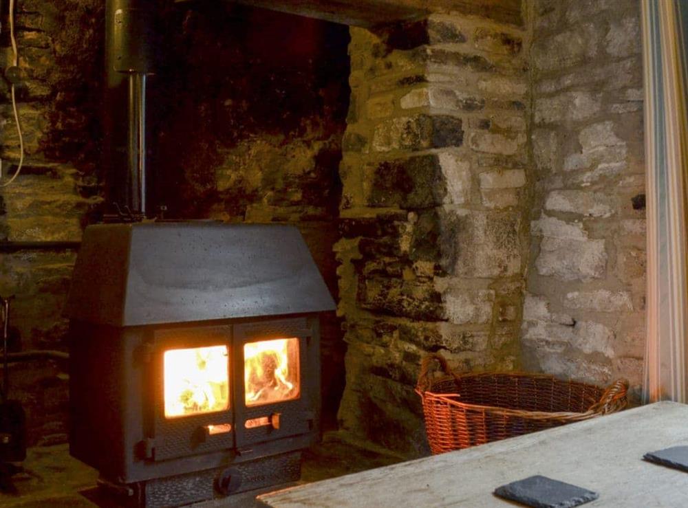 Warm and cosy wood burner at Mulberry Cottage in Acton, near Langton Matravers, Dorset