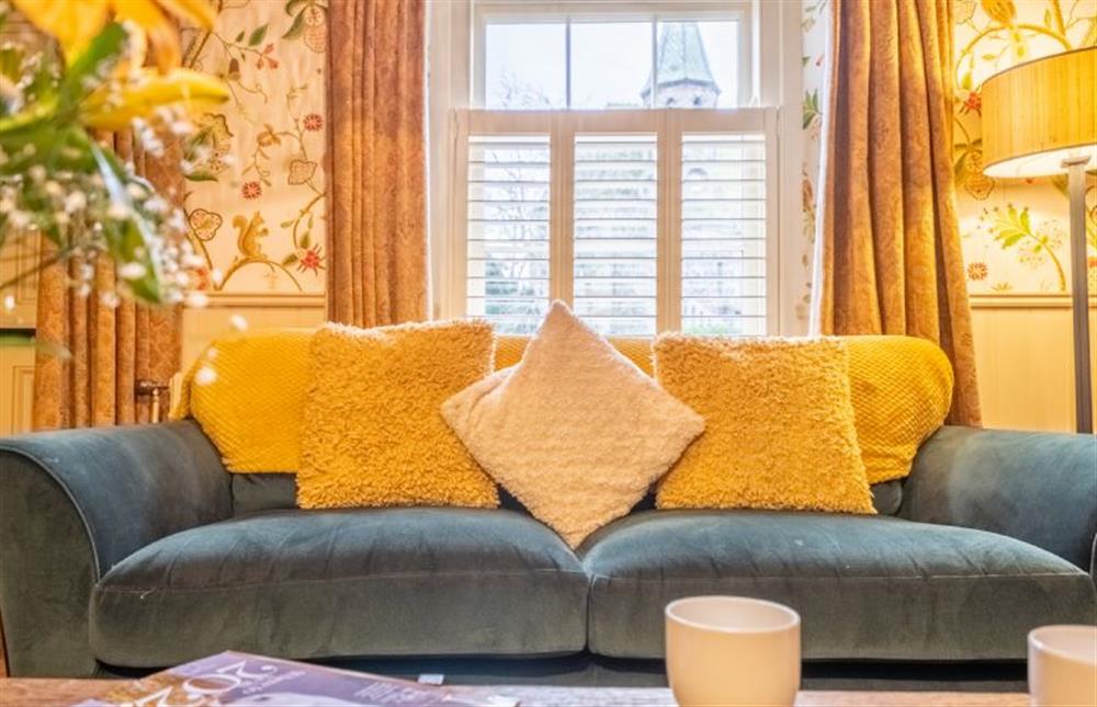 Relax in the comfy sitting room at Mulberry Cottage, Holt