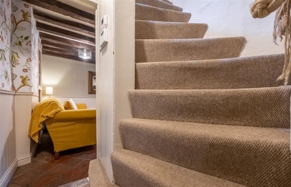 Steep Norfolk winder stairs with narrow treads at Mulberry Cottage, Holt