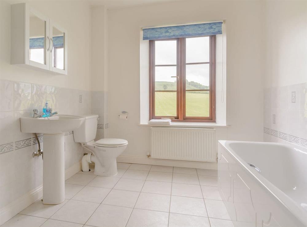 Family bathroom with bath and separate shower cubicle at Mulberry Cottage in North Wooton, near Wells, Somerset