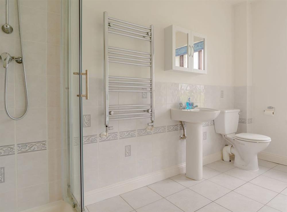 Family bathroom with heated towel rail at Mulberry Cottage in North Wooton, near Wells, Somerset