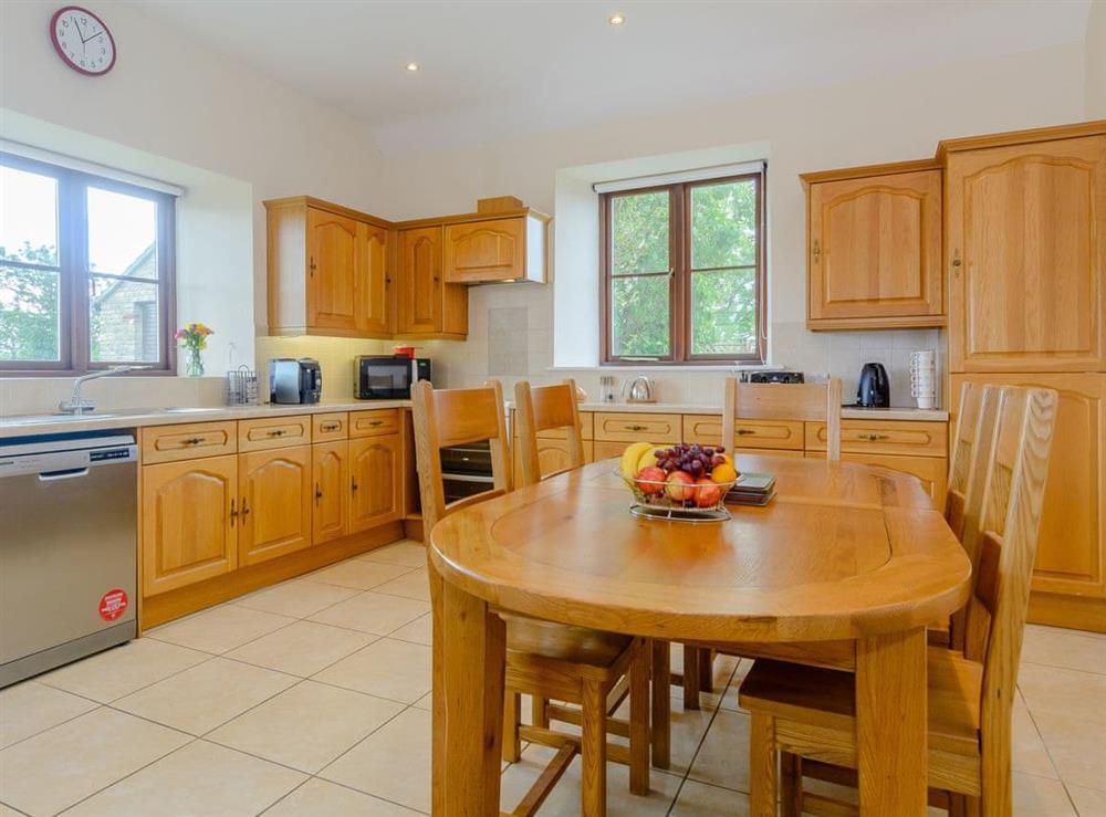 Fully appointed fitted kitchen with dining area at Mulberry Cottage in North Wooton, near Wells, Somerset