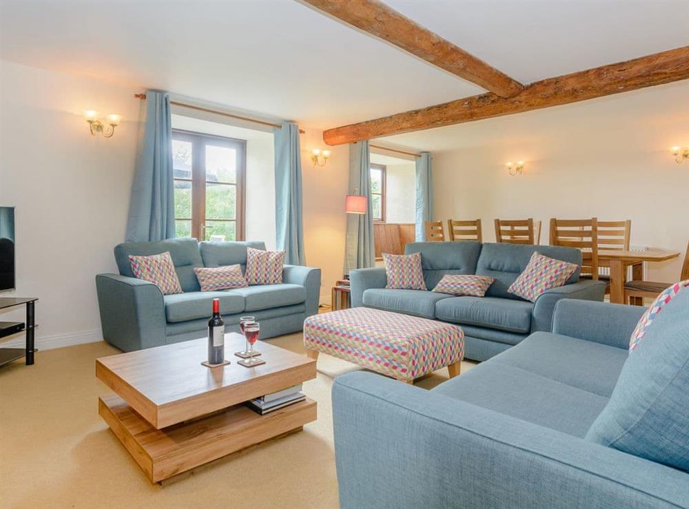 Stylish living and dining room at Mulberry Cottage in North Wooton, near Wells, Somerset