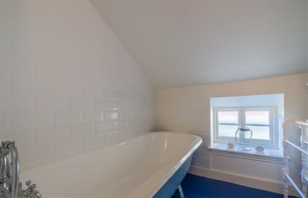 First floor: Bathroom with roll-top bath (photo 2) at Mulberry Cottage, Wells-next-the-Sea