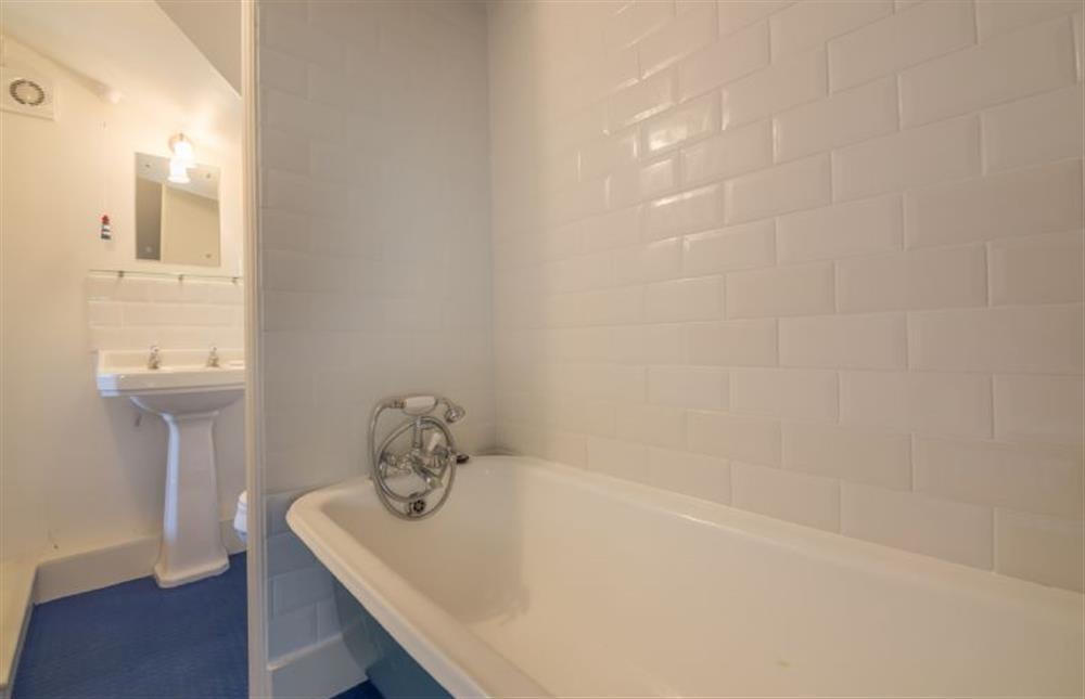 First floor: Bathroom with roll-top bath at Mulberry Cottage, Wells-next-the-Sea