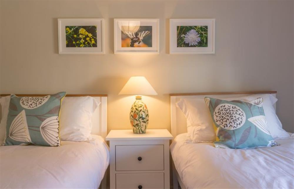 First floor: Bedroom two with twin beds at Mulberry Cottage, Wells-next-the-Sea